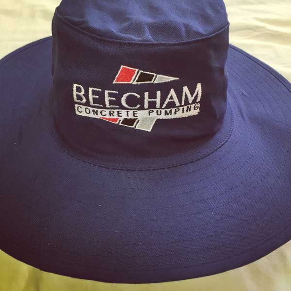 Beecham Concrete Pumping wide brimmed hats embroidered on the front.