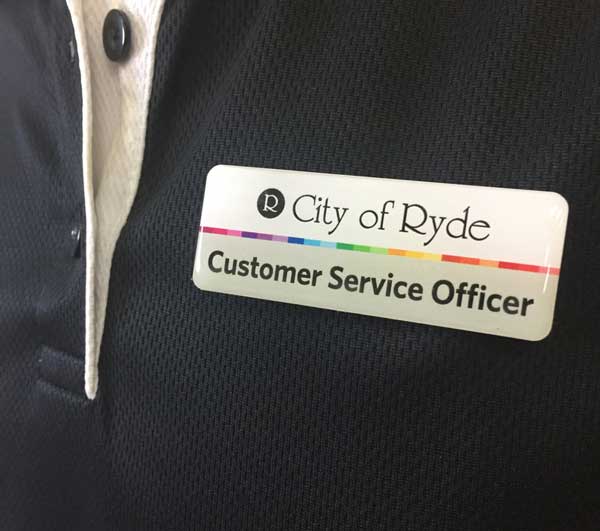 City of Ryde premium name badges printed full colour and finished with a clear resin dome with a magnetic clasp on the back.