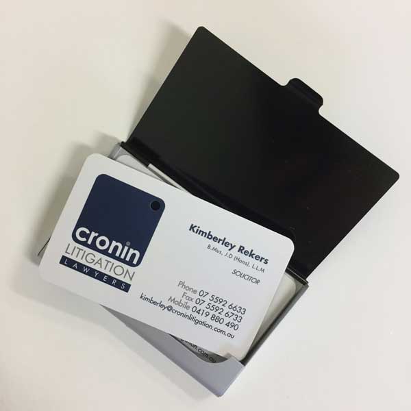 Cronin Litigation Lawyers premium business cards, printed full CMYK colour on both sides on 420gsm artboard, matt celloglaze on both sides and a single hole drilled through the logo.