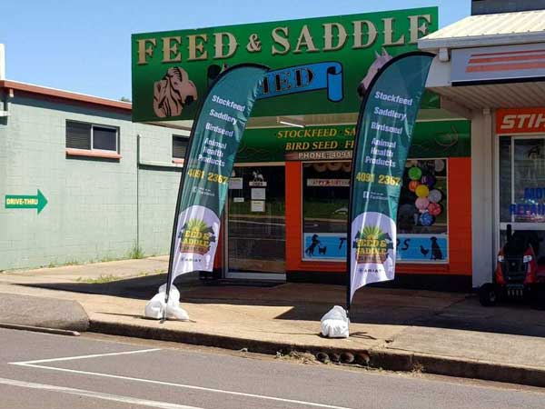 Feed and Saddle Shed shop banner flags on display in Atherton, QLD
