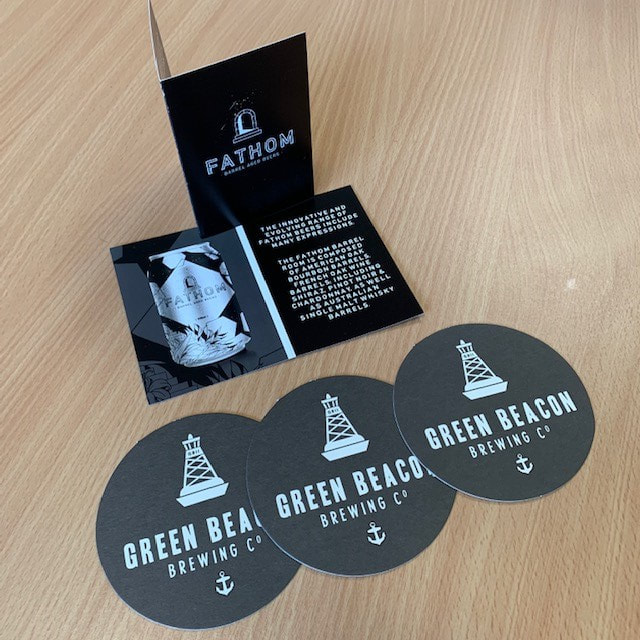 Green Beacon Brewery drink coasters and Fathom barrel aged beer launch brochure